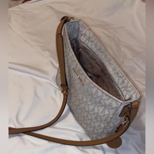 Michael Kors crossbody bag in the color white.